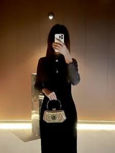 Elegant rhinestone evening bag, luxury party clutch purse with metal handle and sparkling crystals.