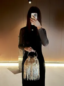 Discover our chic metallic fringe evening bucket bag, perfect for parties and stylish nights out.