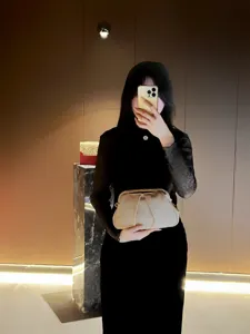Elegant pleated clutch bag for women, shiny evening handbag and stylish crossbody bag.