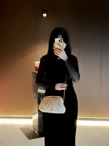 Stylish pleated clutch bag for women featuring a chic chain strap and elegant design.