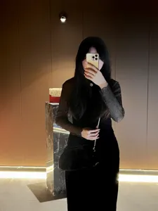 Elegant black pleated evening clutch bag with chain, premium stylish accessory for women detail.