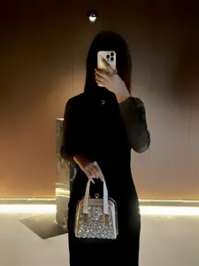 Exquisite clear rhinestone evening bag with metallic frame and white handles for women