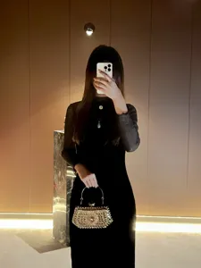 Exquisite rhinestone evening clutch bag detail, perfect for parties and formal dress outfits.