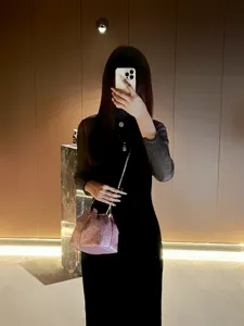 Detailed view of a glittering evening bucket bag with chic chain strap in luxury style.