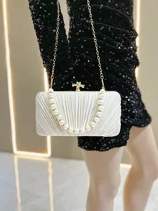 White pleated satin evening clutch bag with pearl handle and metal chain for women party detail.