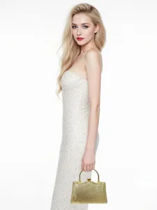 Prachtige gouden avondtas met sprankelend diamanten zonnemotief voor feestelijke looks.