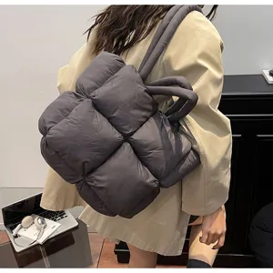 Detailed view of the dark gray quilted padded tote bag, soft and spacious design.