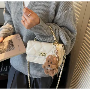 Chic quilted chain shoulder bag with cute plush bear pendant for women daily commute fashion.