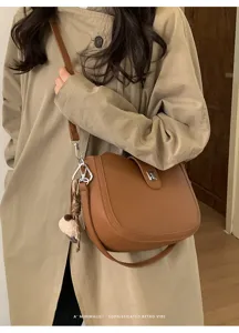Chic minimalist brown saddle bag for women, stylish retro crossbody shoulder bag for daily.