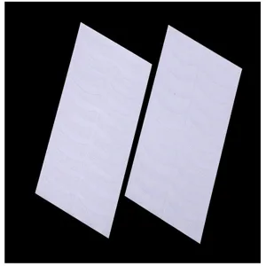 Detail shot of white non-woven eyelash extension under eye pads, professional grafting tools.