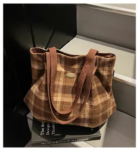 Vintage plaid tote bag detail view, casual shoulder bag with brown patterned fabric.