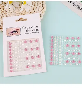 Face gem stickers detail close up pink rhinestones and white pearls for eye makeup decor.