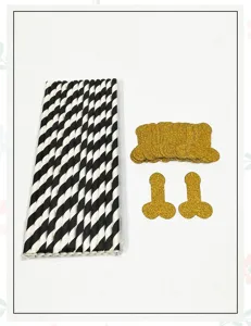 Black and white striped paper straws with golden glitter party cutouts for fun celebrations.
