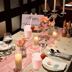 Valentine party paper straws for drinks, romantic dinner table setting scene details.