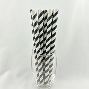 Black and white striped paper straws close up detail view, eco friendly drinking straws.