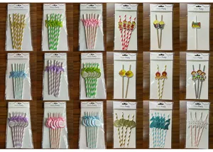 Decorative paper straws set for party celebration with assorted colorful designs and cute toppers.