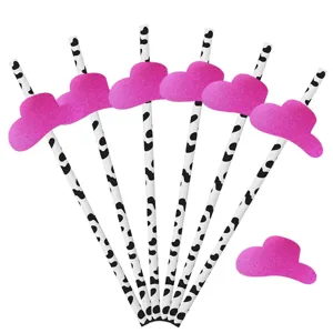 Pailles en papier a motif de vache rose avec deco de mini chapeau brillant de fete.