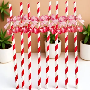Red and white striped paper straws with pink bow and cherry decoration for party decor