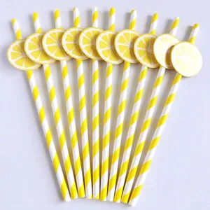 Yellow striped paper drinking straws with cute lemon slice cutouts, perfect for party decor.