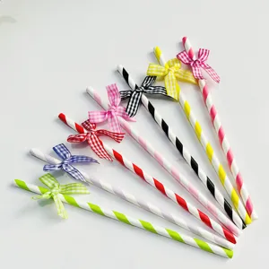 Colorful striped paper straws detail view with cute checkered bows, perfect for party decor