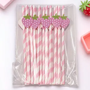 Cute pink striped paper drinking straws with strawberry cards, perfect detail for party decor.