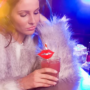 Creative funny red lips paper drinking straw for party and beverage decoration, stylish design.