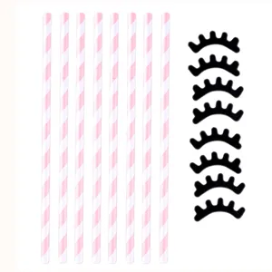 Cannucce di carta a righe rosa e decorazioni di ciglia nere per festa di compleanno.