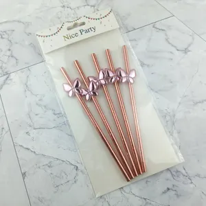 Rose gold paper drinking straws with pink butterfly decorations, perfect for party decor.