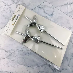 Detailed view of silver sequin mermaid tail paper straws, perfect for party and cake decor.
