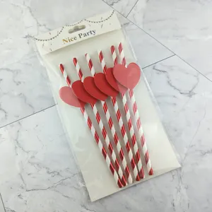 Red heart paper straws detail shot for holiday party celebration and beverage decoration