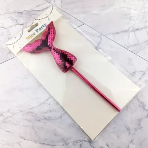 Pink sequin mermaid tail cake topper detail, sparkling party decoration straw for kids birthdays.