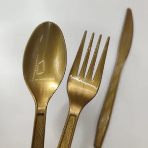 Disposable gold plastic cutlery set, elegant spoon fork knife for party events detail view
