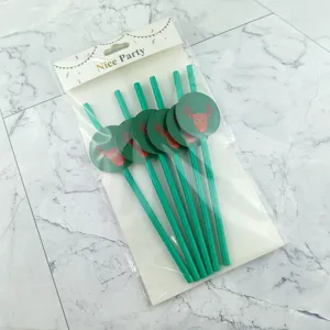Christmas green paper straws set with cute reindeer toppers, perfect for holiday party drinks.