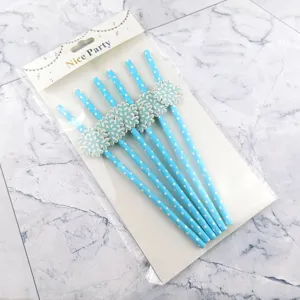 Blue polka dot paper straws with cute snowflake cutouts for party drinks and celebrations.