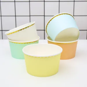 Colorful disposable paper dessert cups featuring elegant gold foil scalloped rims for parties