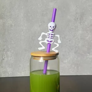 Halloween party creative plastic straw with cute white skeleton decoration detail shot.