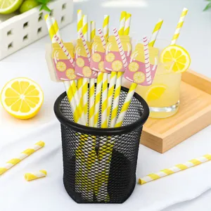Vue détaillée de pailles en papier à rayures jaunes et blanches avec décor citron pour fêtes.
