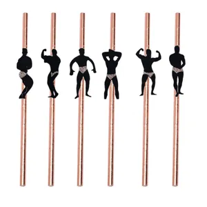 Rose gold paper straws with funny muscular man silhouette cutouts for bachelorette party decor.
