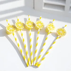 Yellow and white striped paper straws with lemon slice cards for creative party decor.