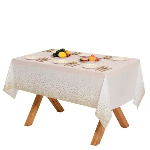 Nappe carrée jetable avec des pois dorés pour la décoration de fête d'anniversaire.