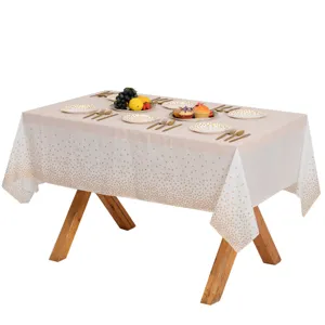 Nappe de fête jetable avec impression de pois dorés, idéale pour les anniversaires et événements.