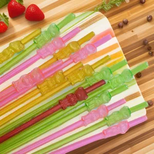 Close-up of colorful reusable plastic drinking straws featuring cute 3D bear designs for parties.