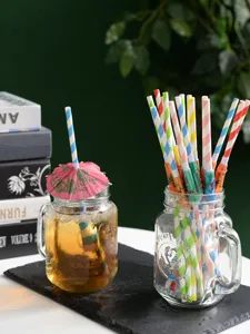 Colorful paper drinking straws with cute umbrellas, eco-friendly party beverage decoration.