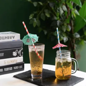 Colorful paper drinking straws with mini umbrella decorations for party drinks and cocktails.