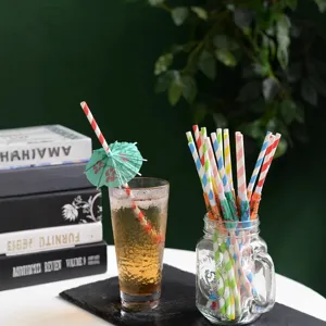 Colorful paper drinking straws with cute umbrellas, eco-friendly biodegradable party supplies.