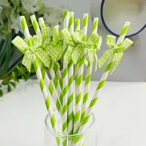 Green striped paper straws with grid bows, perfect for party decoration and birthday dessert tables.