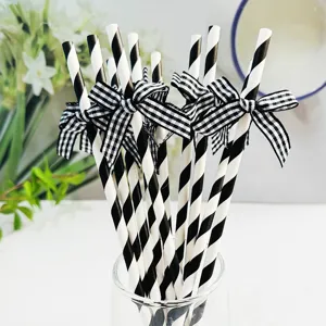 Black and white striped paper straws with gingham bows for party decoration and events.