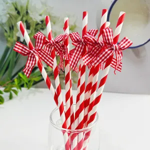 Red and white striped paper straws with grid bows, perfect for party and dessert table decor.