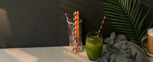 Halloween paper straws detail view featuring pumpkin and ghost patterns for party decor.