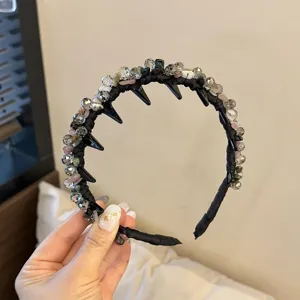 Crystal stone tooth headband detail view, handmade wire-wrapped black hair hoop for women